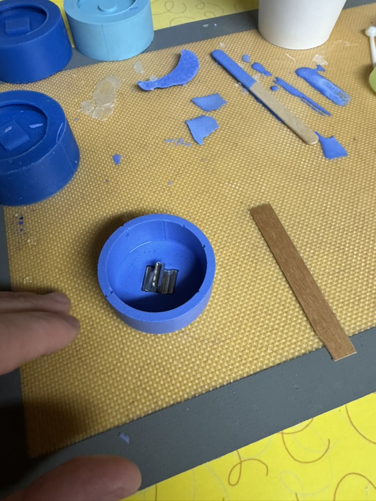 Cast Candle Holder - Wick clip seated in the mold recess