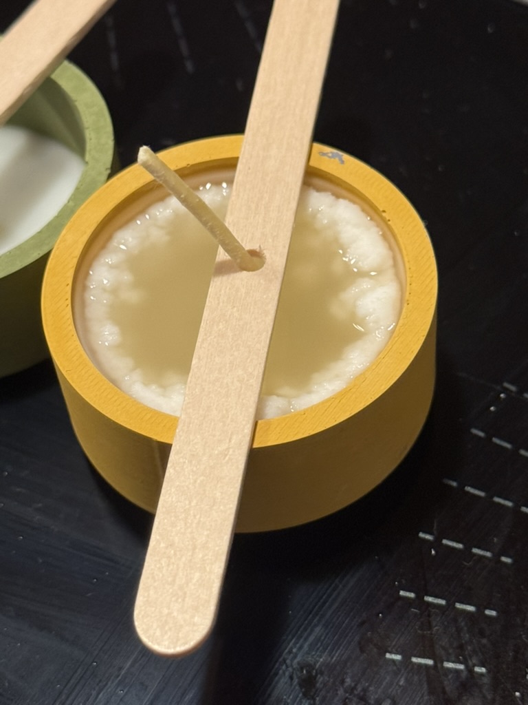 Cast Candle Holder - Pouring the beeswax/soy melt around the wick
