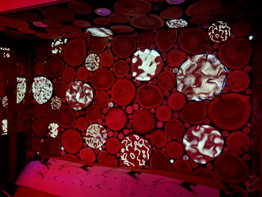 Milespalooza - Liquid forms mapped onto the log-round wall