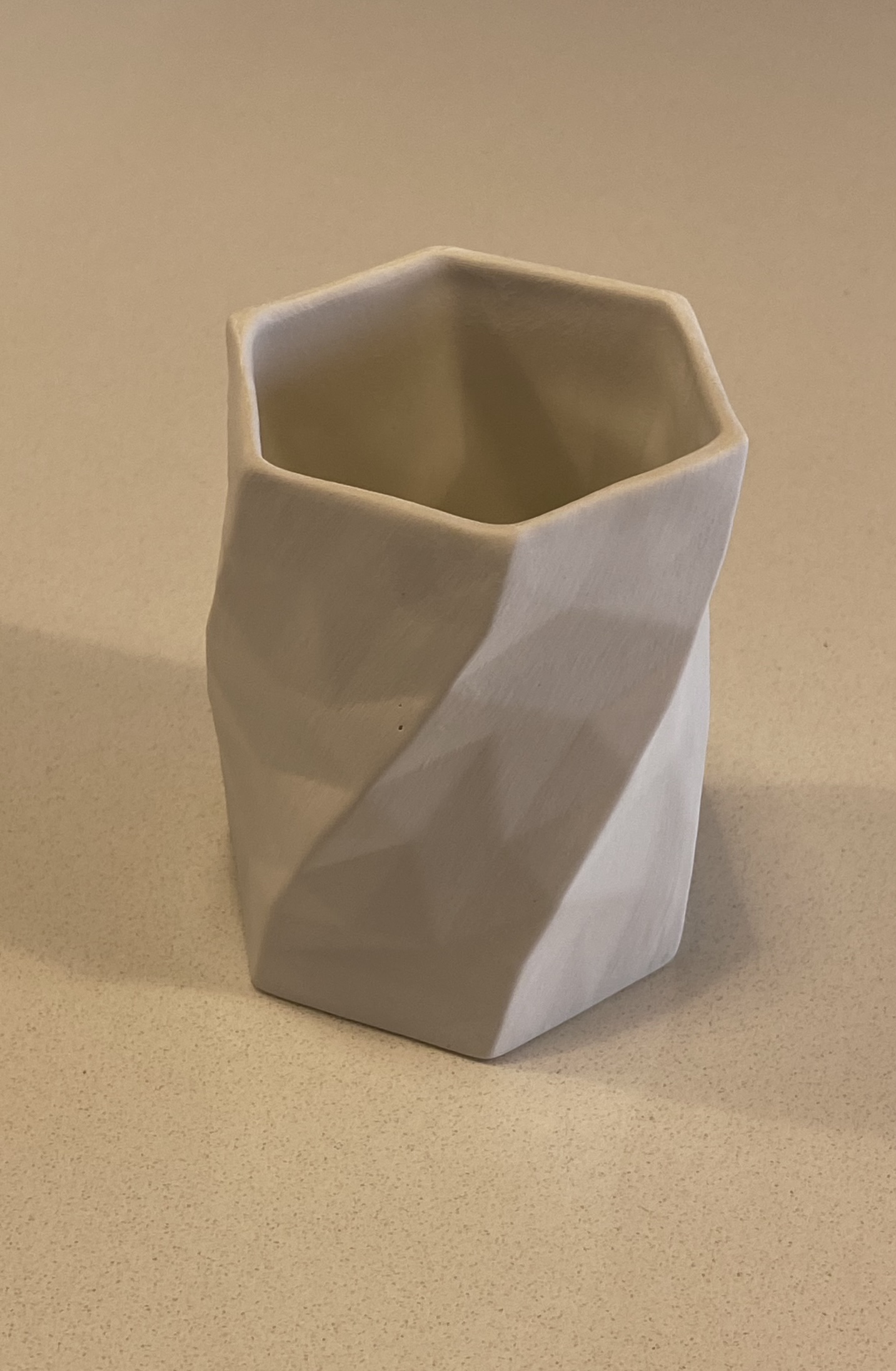 Slip-Cast Porcelain Tumbler - The fired porcelain tumbler, facets and quarter twist